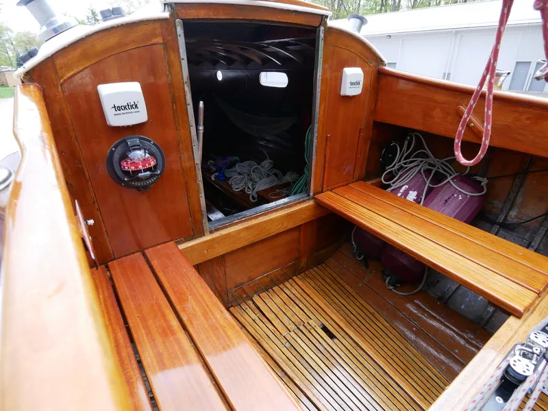 Slide: The Image of 1935 Custom 44' 30-Square Meter Sailing Yacht cockpit with wooden benches and storage. - 23