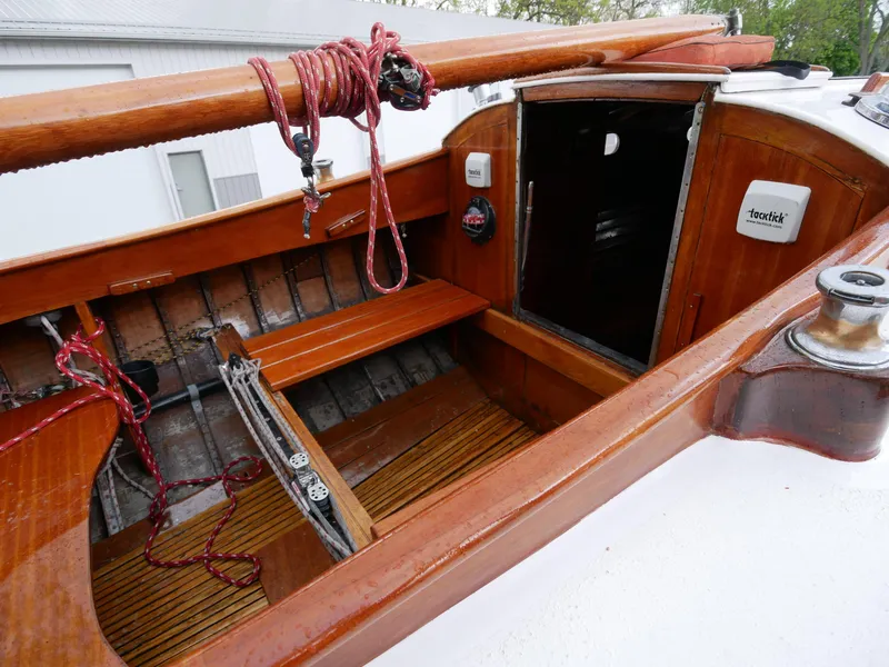 Slide: The Image of 1935 Custom 44' 30-Square Meter Sailing Yacht cockpit with wooden finish and open cabin door. - 29