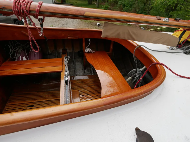 Slide: The Image of 1935 Custom 44' 30-Square Meter Sailing Yacht cockpit with wooden benches and rigging. - 30