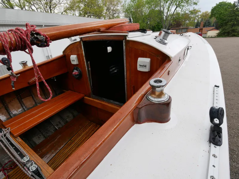 Slide: The Image of 1935 Custom 44' 30-Square Meter Sailing Yacht cockpit with wooden details and open hatch. - 31