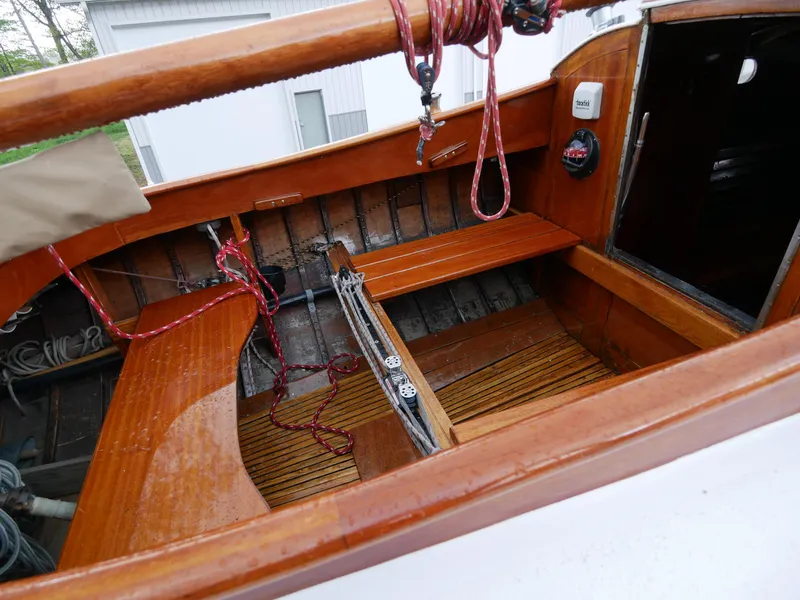 Slide: The Image of 1935 Custom 44' 30-Square Meter Sailing Yacht cockpit with wooden seating and rigging. - 32
