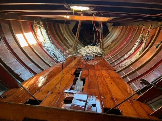 Slide: The Image of Interior of a 1935 Custom 44' 30-Square Meter Sailing Yacht with wooden planks and ropes. - 39