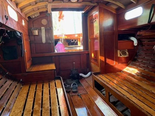 Slide: The Image of Interior of a 1935 Custom 44' 30-Square Meter Sailing Yacht with wooden benches. - 42