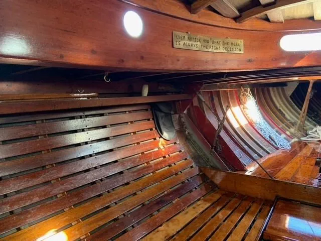 Slide: The Image of Interior of a 1935 Custom 44' 30-Square Meter Sailing Yacht with wooden benches. - 46