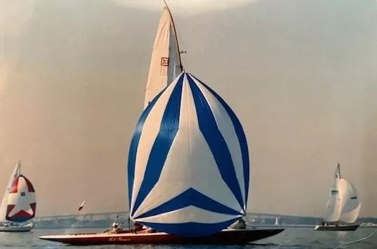 Slide: The Image of 1935 Custom 44' 30-Square Meter Sailing Yacht with blue and white spinnaker in a regatta. - 47