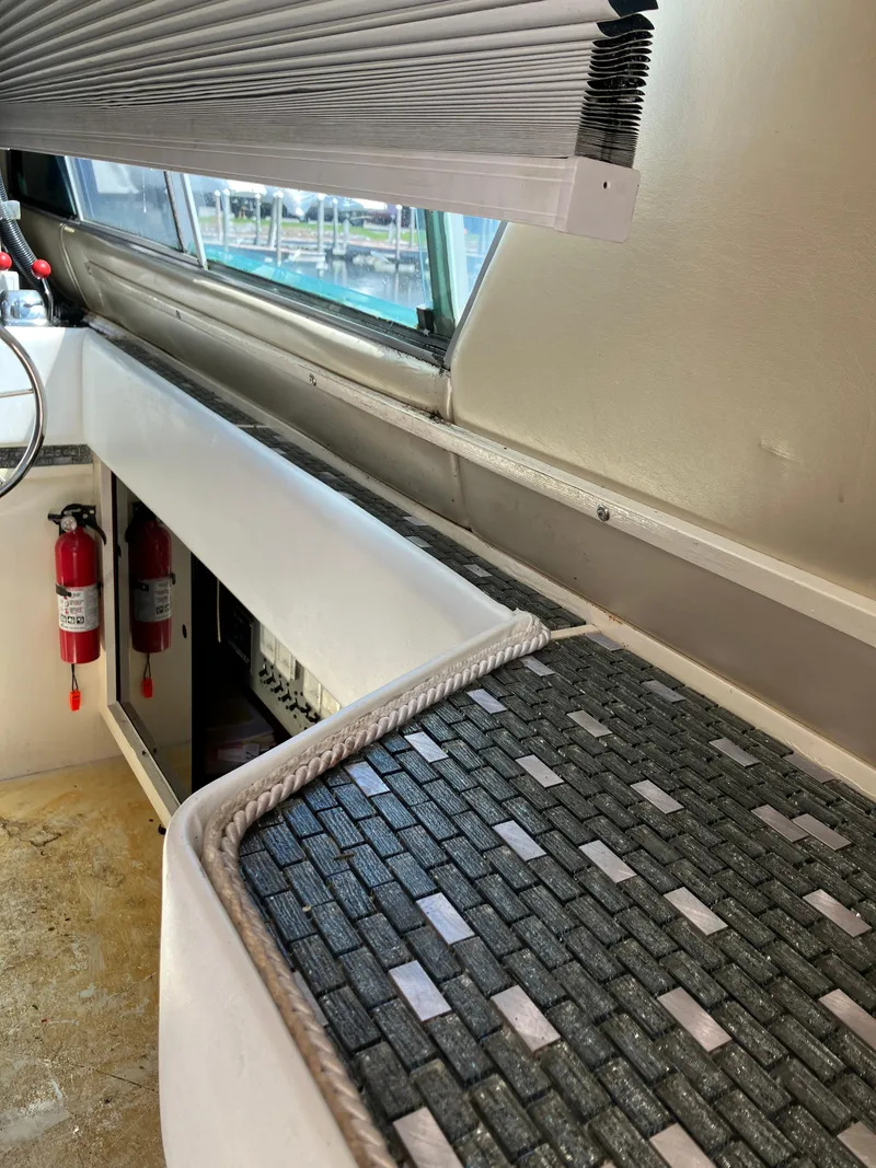 Slide: The Image of Interior of 1985 Cruisers Yachts 338 Chateau Vee with safety equipment. - 11