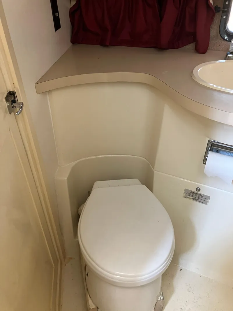 Slide: The Image of 1985 Cruisers Yachts 338 Chateau Vee bathroom with toilet and sink. - 20
