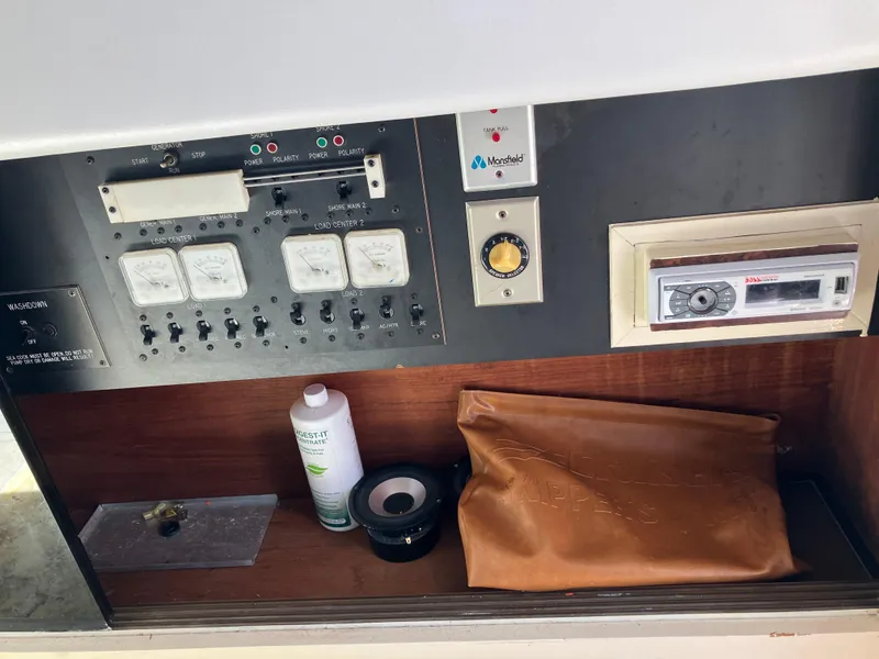 Slide: The Image of Control panel of 1985 Cruisers Yachts 338 Chateau Vee with gauges and storage. - 7