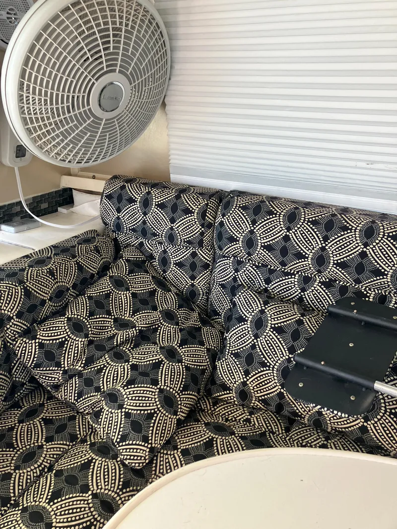 Slide: The Image of Interior of 1985 Cruisers Yachts 338 Chateau Vee with patterned upholstery and fan. - 9