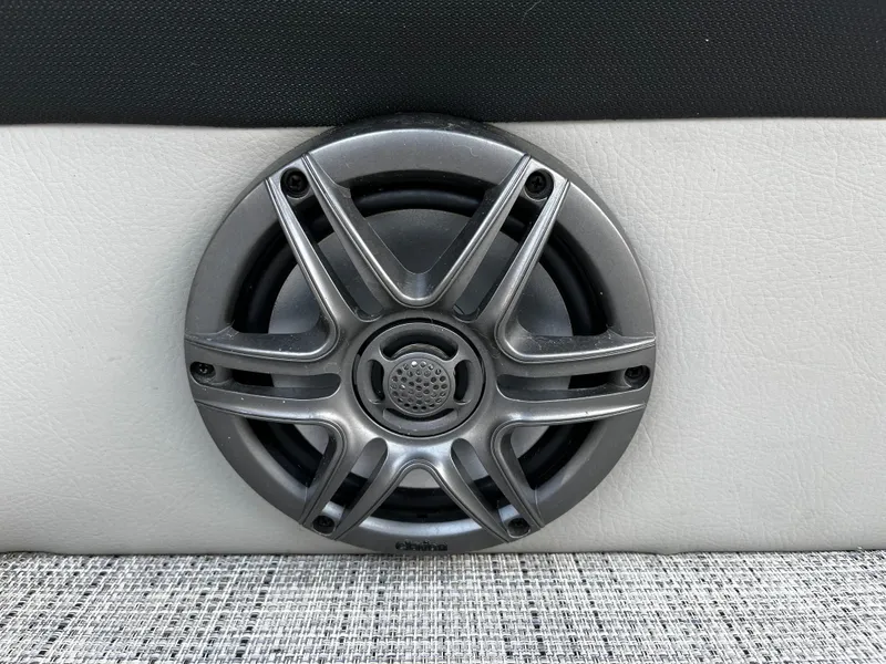 Slide: The Image of 2022 South Bay 224 RS LE boat speaker on white and black upholstery. - 16