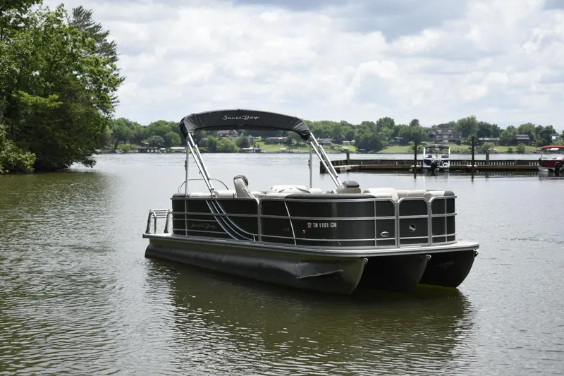 Slide: The Image of 2022 South Bay 224 RS LE pontoon boat on a calm lake. - 3