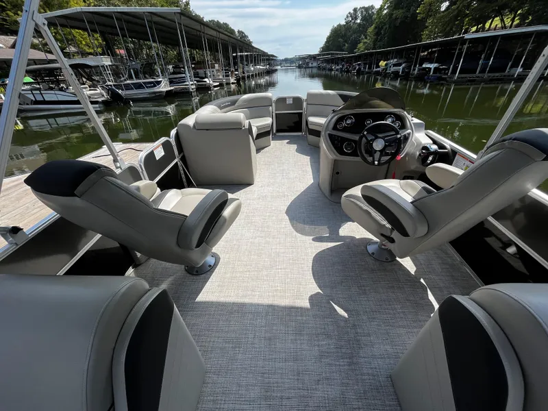 Slide: The Image of 2022 South Bay 224 RS LE pontoon boat interior with spacious seating and modern helm. - 5