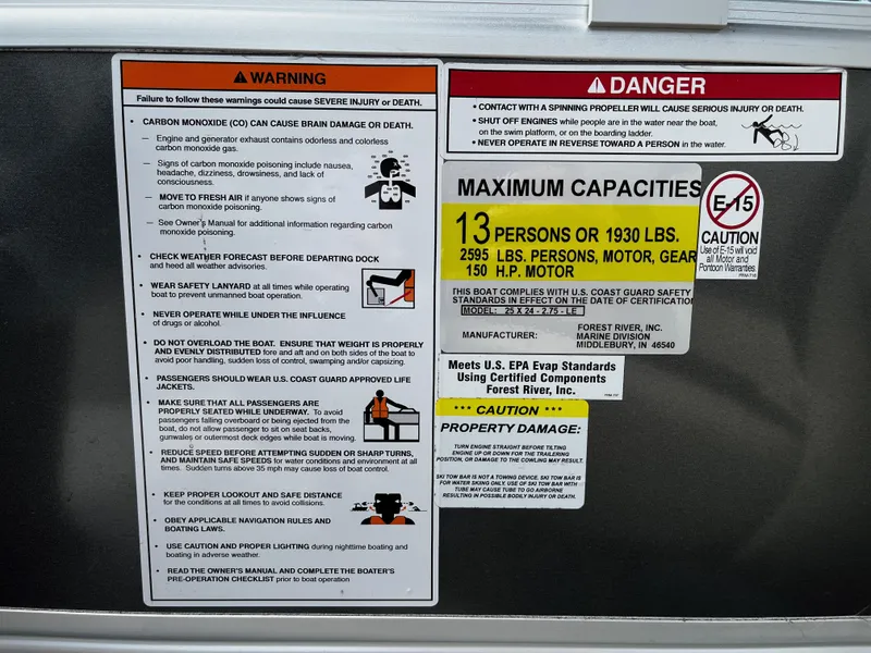 Slide: The Image of 2022 South Bay 224 RS LE safety and capacity warning labels, maximum capacity 13 persons or 1930 lbs. - 7