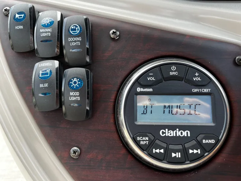 Slide: The Image of Control panel of 2022 South Bay 224 RS LE with Clarion stereo and various switches. - 8