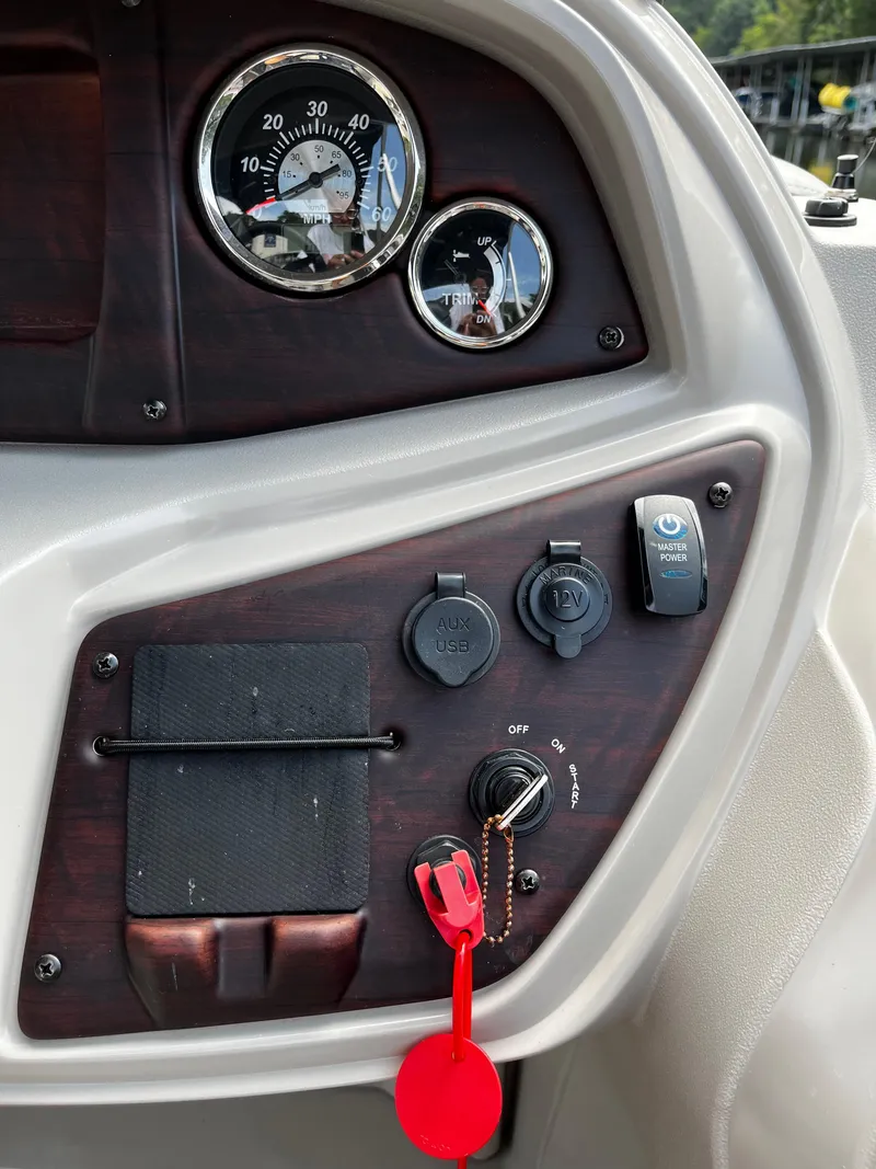 Slide: The Image of Control panel of a 2022 South Bay 224 RS LE pontoon boat. - 10