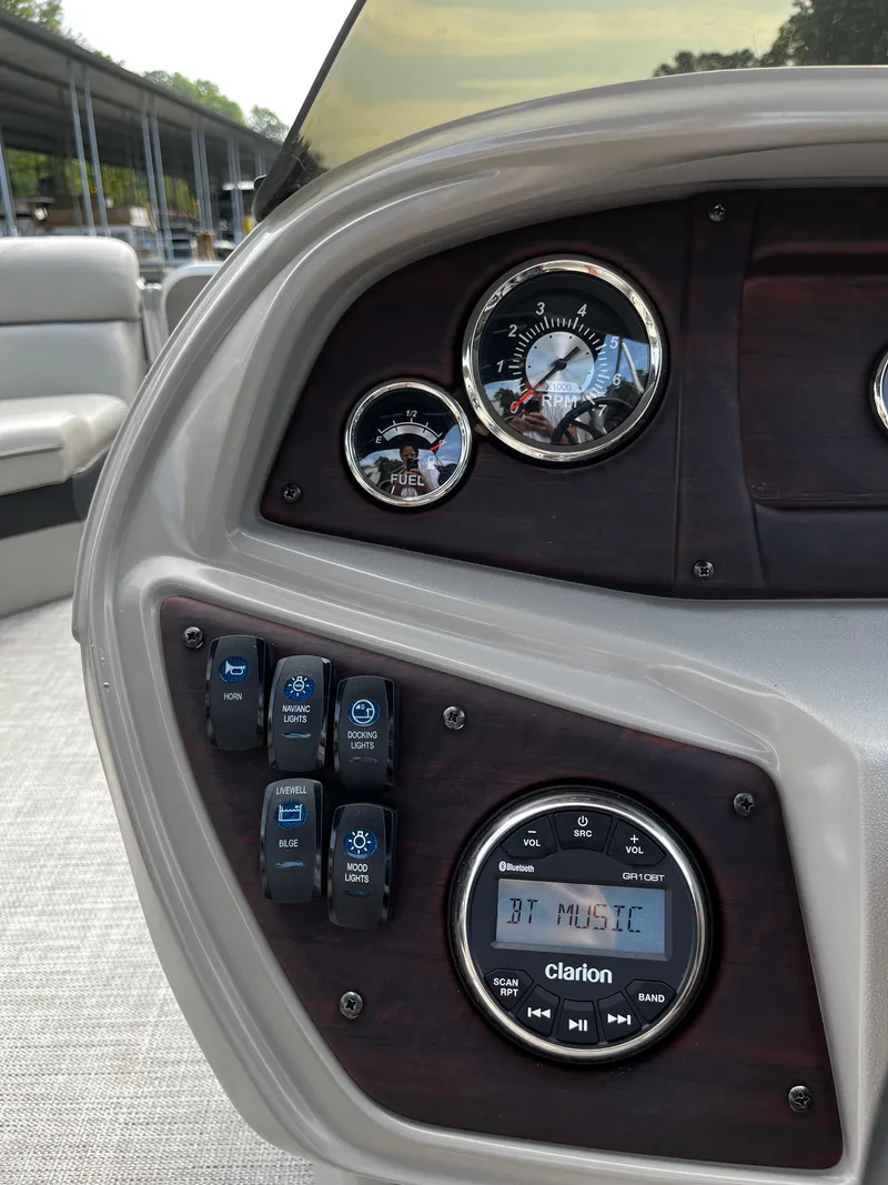 Slide: The Image of Control panel of 2022 South Bay 224 RS LE boat with Clarion audio system. - 11