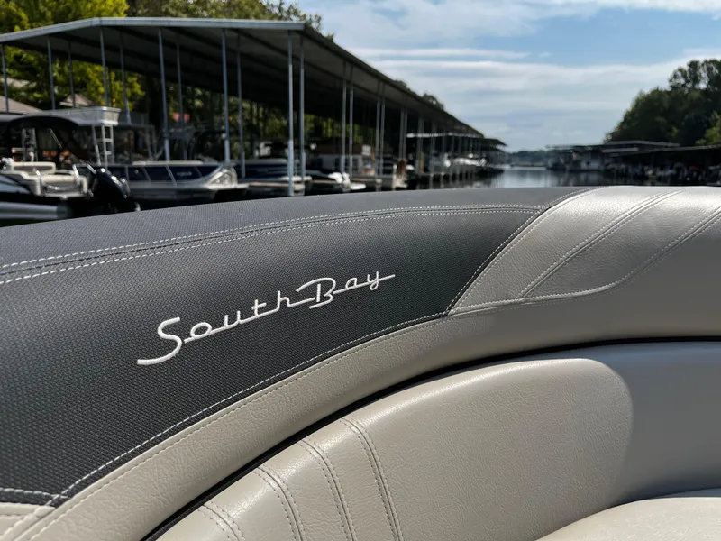 Slide: The Image of 2022 South Bay 224 RS LE boat interior at a marina. - 16