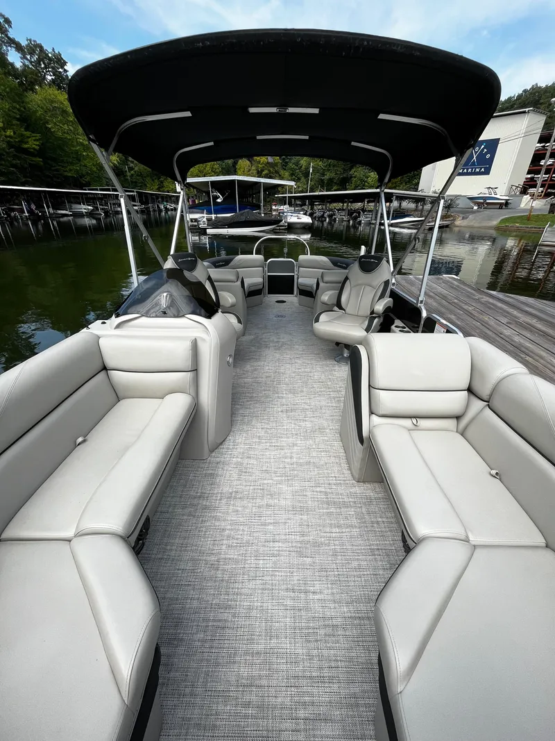Slide: The Image of 2022 South Bay 224 RS LE pontoon boat with spacious seating and canopy. - 5