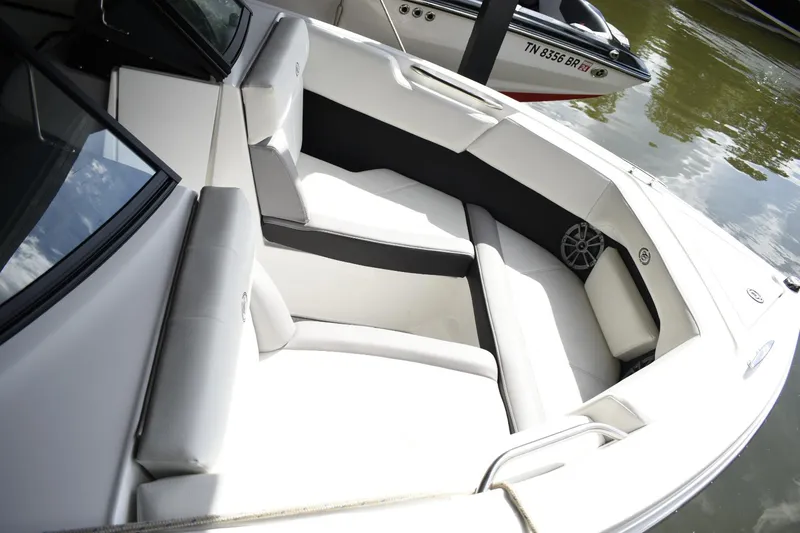 Slide: The Image of 2023 Cobalt CS22 boat interior with white and gray seating. - 4