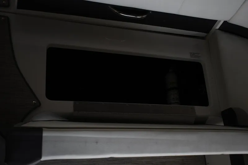 Slide: The Image of Storage compartment in 2023 Cobalt CS22 boat interior. - 5