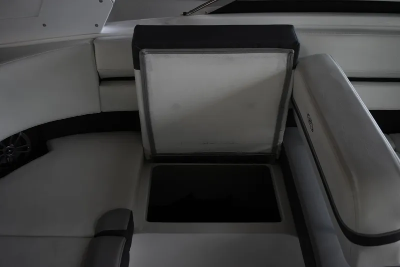 Slide: The Image of 2023 Cobalt CS22 boat interior with open storage compartment. - 6