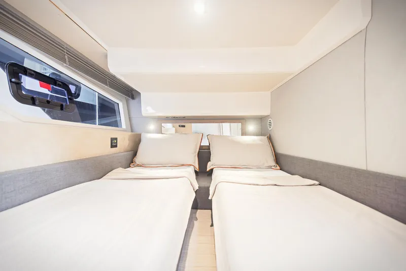 Slide: The Image of 2024 Sessa Marine Fly 48 cabin with twin beds and modern interior design. - 10