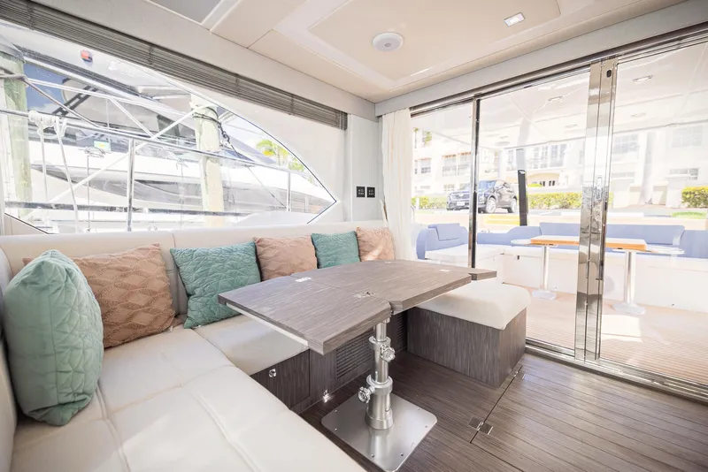 Slide: The Image of Luxurious interior of 2024 Sessa Marine Fly 48 yacht with elegant seating and table. - 15