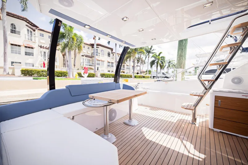 Slide: The Image of Luxurious 2024 Sessa Marine Fly 48 yacht interior with elegant seating and wooden flooring. - 16