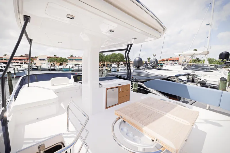 Slide: The Image of 2024 Sessa Marine Fly 48 yacht deck with marina view. - 20