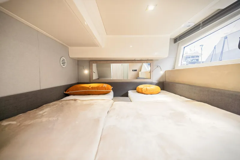 Slide: The Image of Luxurious cabin interior of 2024 Sessa Marine Fly 48 yacht with twin beds. - 7