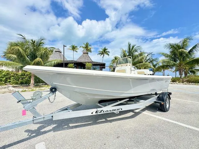 Slide: The Image of 2024 Bulls Bay 2000 boat on a trailer in a marina. - 1