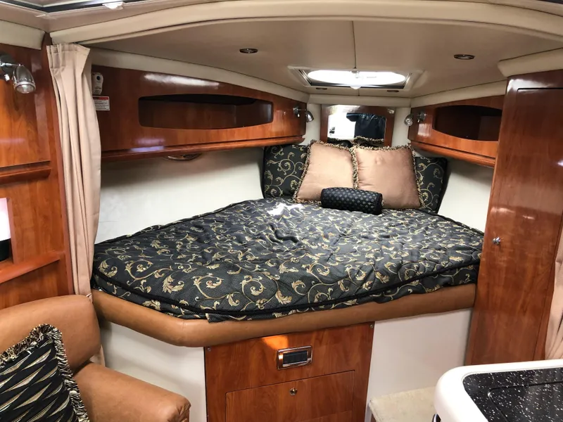 Slide: The Image of Luxurious cabin interior of 2007 Four Winns 318 Vista yacht with elegant bedding. - 15
