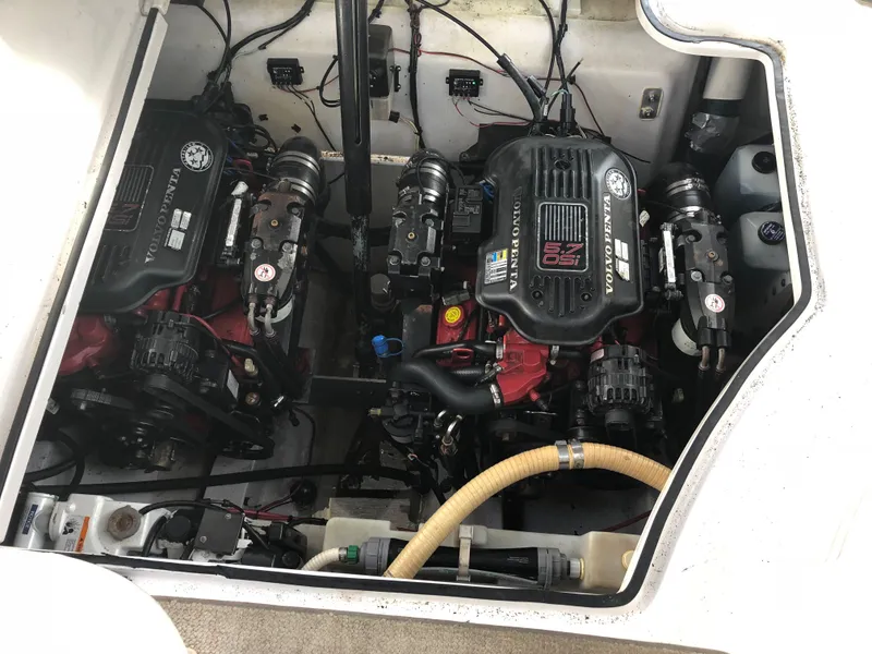 Slide: The Image of Engine compartment of 2007 Four Winns 318 Vista boat, featuring dual inboard motors. - 21