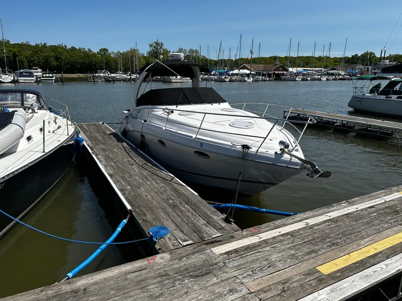 Slide: The Image of 2007 Four Winns 318 Vista boat docked at a marina on a sunny day. - 5