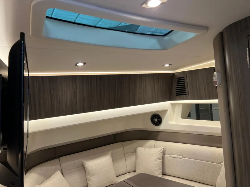 Slide: The Image of 2024 Sea Ray SLX 400 interior cabin with modern design and skylight. - 24