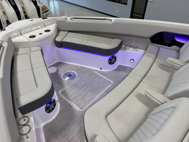 Slide: The Image of 2024 Sea Ray SLX 400 boat interior with luxurious seating and ambient lighting. - 30