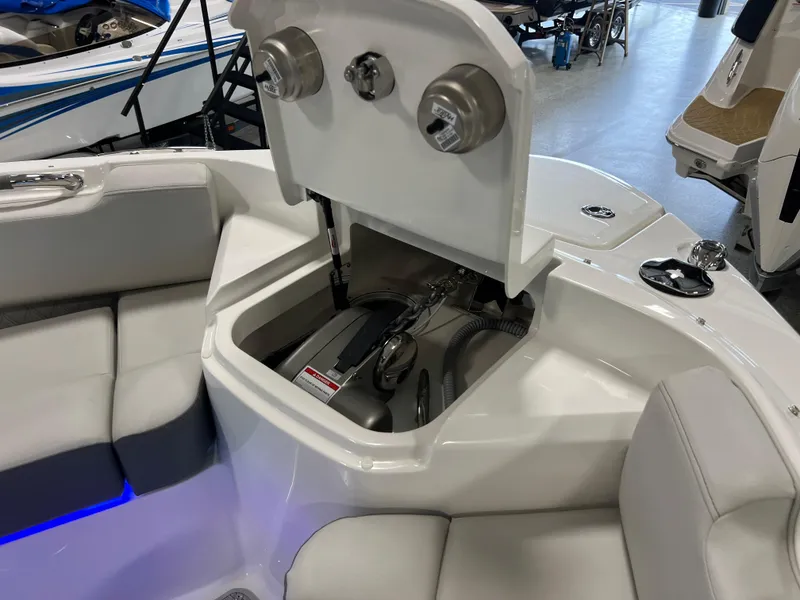 Slide: The Image of 2024 Sea Ray SLX 400 boat interior, featuring storage compartment and seating area. - 33