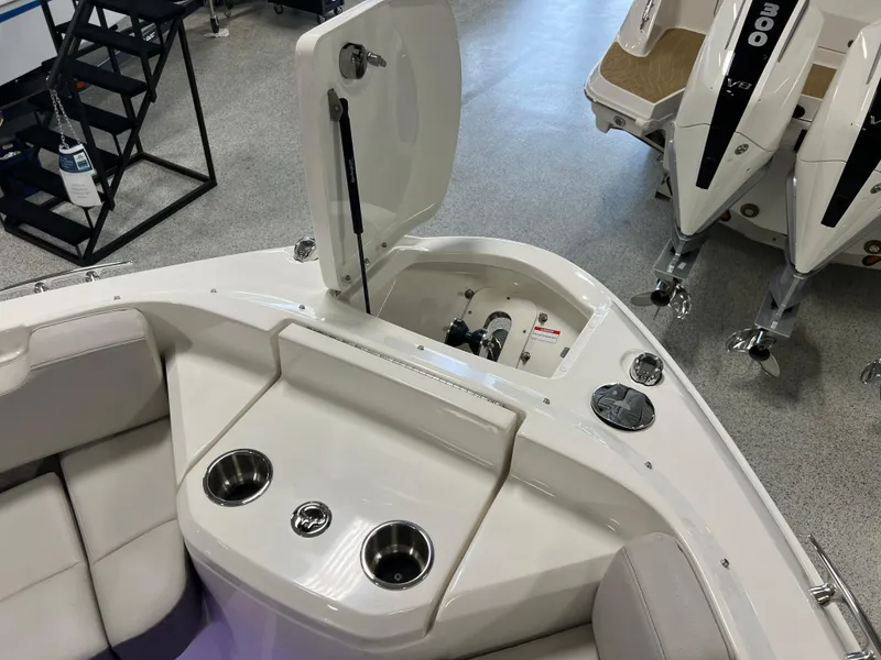 Slide: The Image of 2024 Sea Ray SLX 400 boat interior with seating and cup holders. - 34