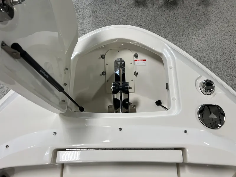 Slide: The Image of 2024 Sea Ray SLX 400 anchor compartment with open hatch, showcasing sleek design and functionality. - 35