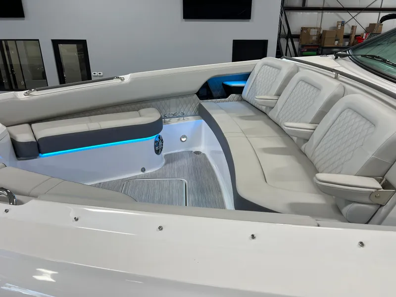 Slide: The Image of 2024 Sea Ray SLX 400 boat interior with luxurious seating and ambient lighting. - 36