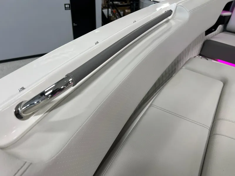 Slide: The Image of 2024 Sea Ray SLX 400 interior, featuring luxurious white seating and sleek metal accents. - 38