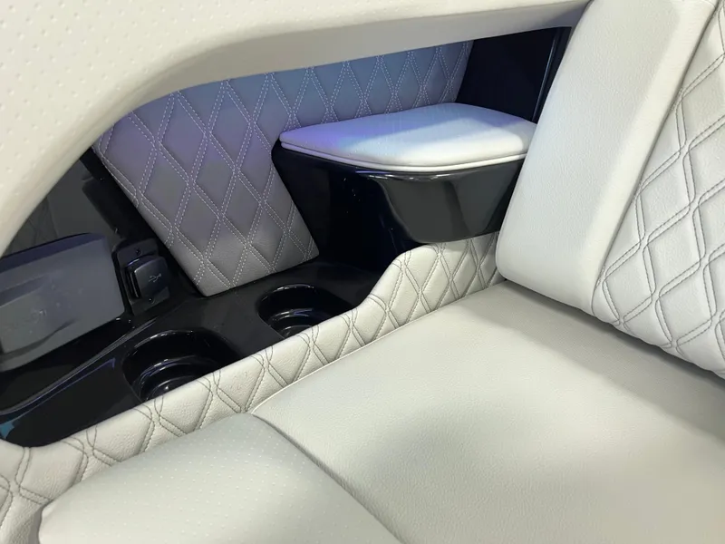 Slide: The Image of 2024 Sea Ray SLX 400 interior with luxurious quilted leather seating and cup holders. - 39