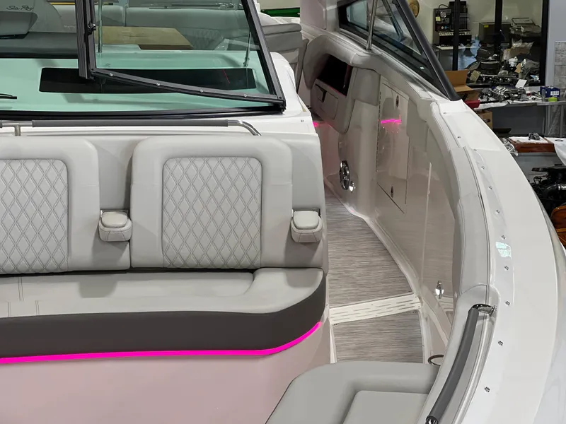 Slide: The Image of 2024 Sea Ray SLX 400 boat interior with modern seating and ambient lighting. - 4