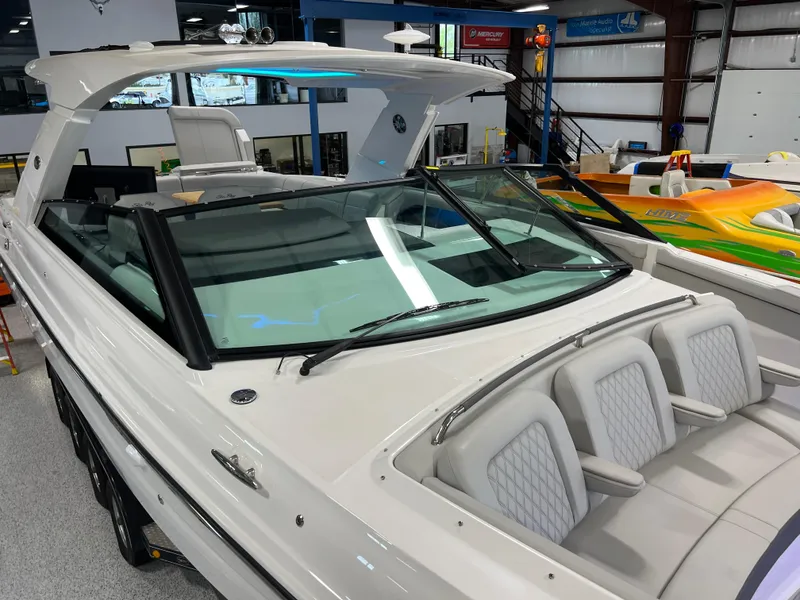 Slide: The Image of 2024 Sea Ray SLX 400 luxury boat with sleek design in showroom. - 40