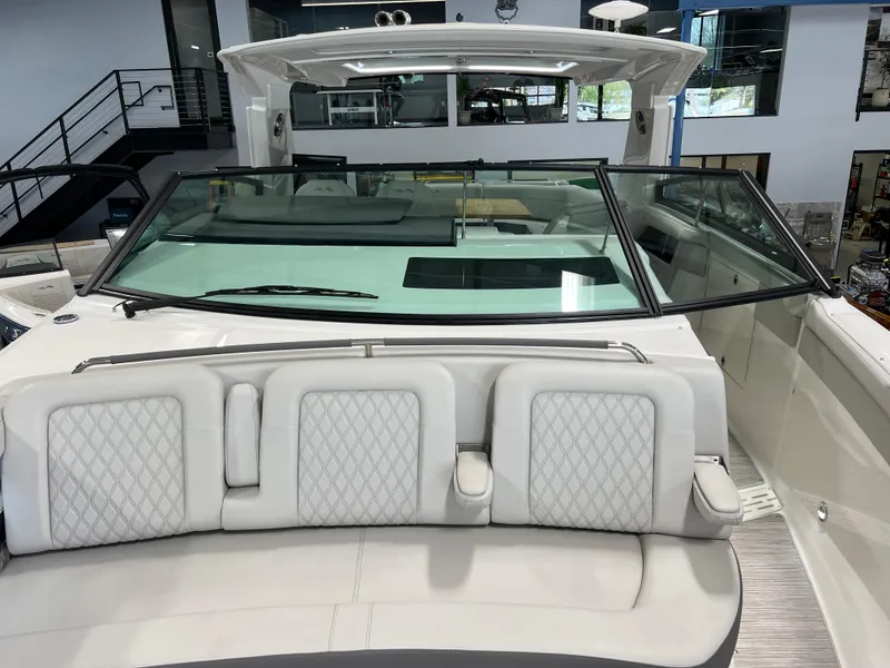Slide: The Image of 2024 Sea Ray SLX 400 boat interior with luxurious seating and sleek design. - 41