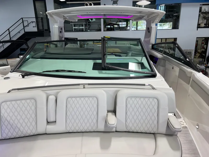 Slide: The Image of 2024 Sea Ray SLX 400 boat interior with luxurious seating and modern design. - 42