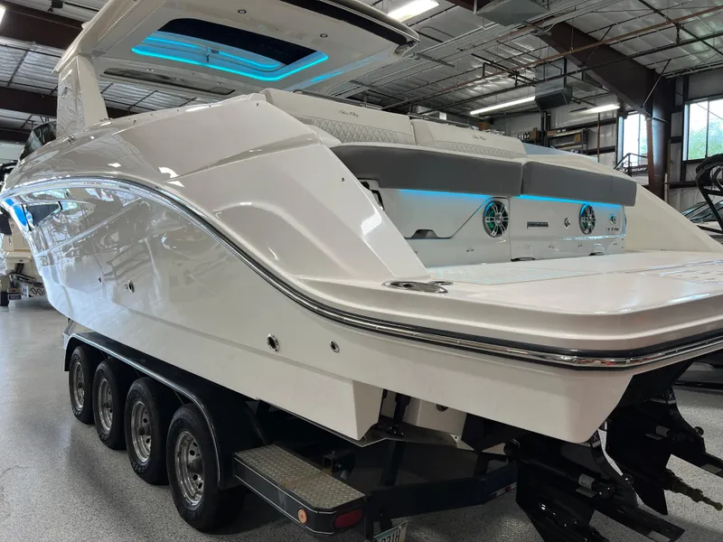 Slide: The Image of 2024 Sea Ray SLX 400 boat on trailer in indoor showroom. - 6