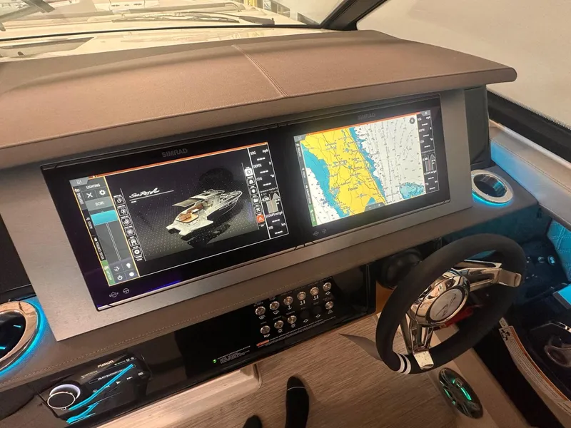 Slide: The Image of Sea Ray SLX 400 2024 dashboard with navigation and control screens. - 66