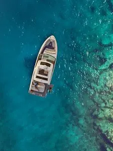 Slide: The Image of Aerial view of 2024 Sea Ray SLX 400 yacht on clear blue water. - 69