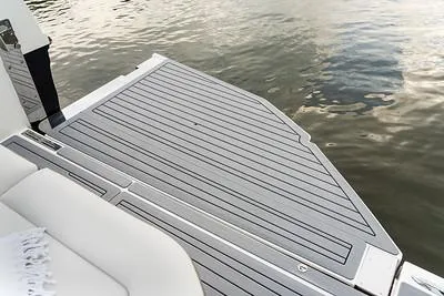 Slide: The Image of 2024 Sea Ray SLX 400 swim platform with water in the background. - 77